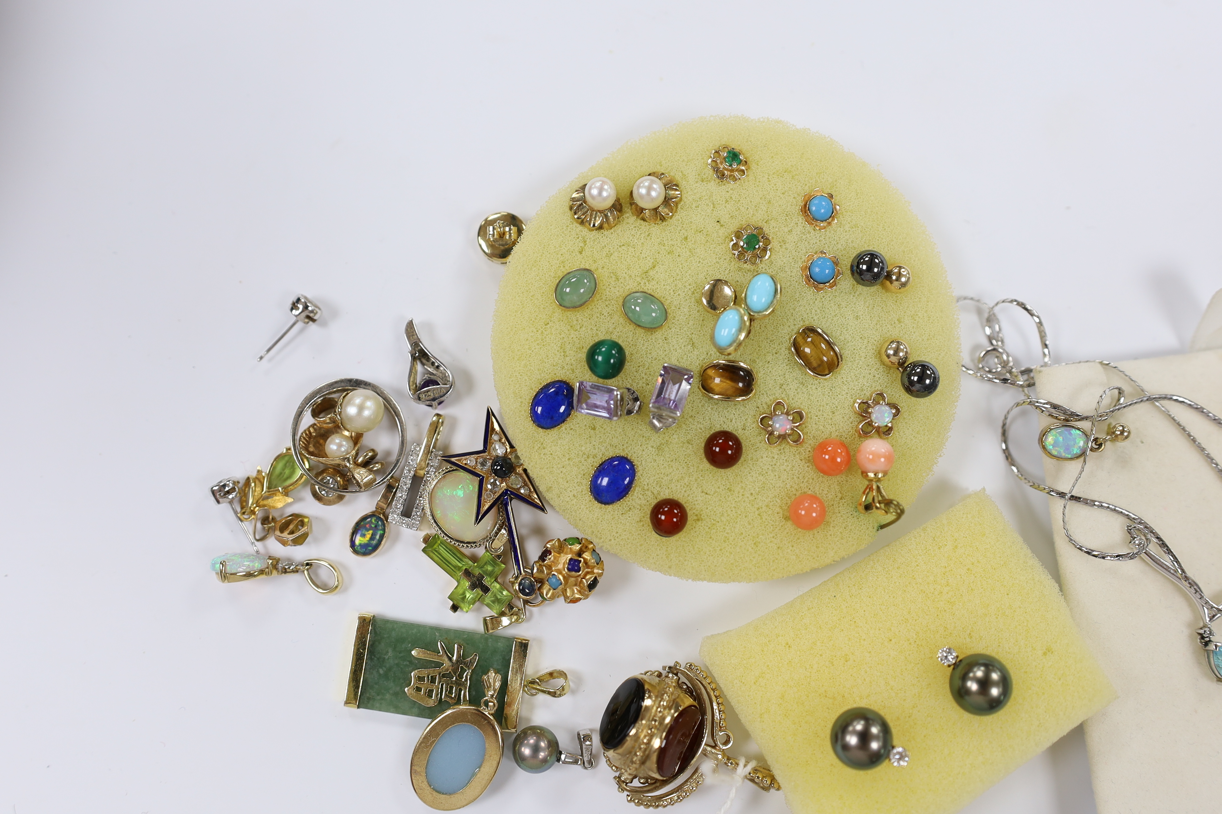 A quantity of mainly modern 9ct gold or yellow metal and gem set jewellery, including earrings, ring, fob seal, pendants, etc. and a pair of 750 Tahitian pearl and diamond set ear studs.
